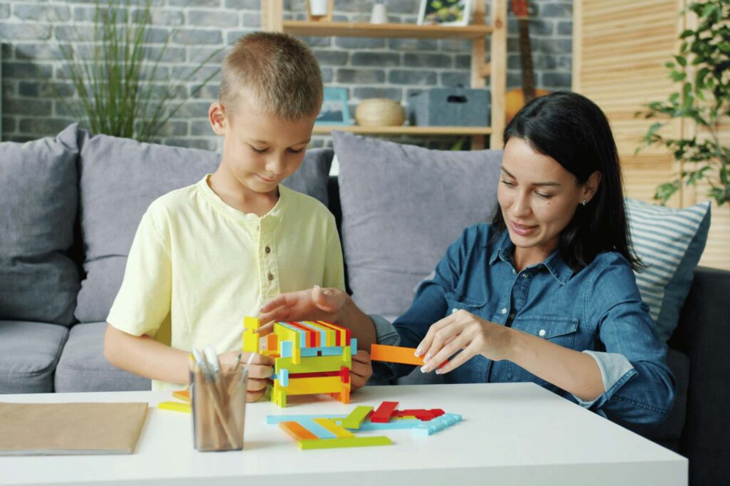 Stress management techniques: A mother practicing mindfulness with her son who has autism